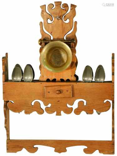 A wooden spoon rack with pewter spoons and with a bronze mortar and pestle. 19th century.