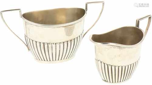 (2) Piece silver set of creamers.