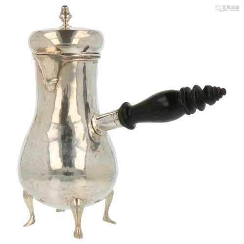 Silver mocha pot with ebony wood handle, a hammered baluster shaped body on four feet with bird beak