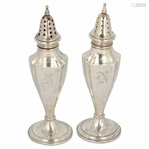 Set of silver pepper and salt casters in tapering lobed Empire-style.