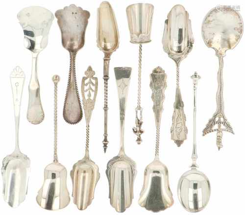 (12) Pieces of silver sugar scoops.