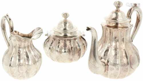 Silver coffee pot with set of creamers.