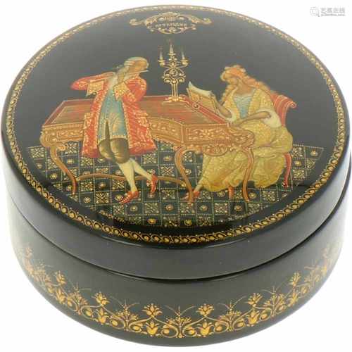 A round Russian lacquer box with depiction of a music playing couple.