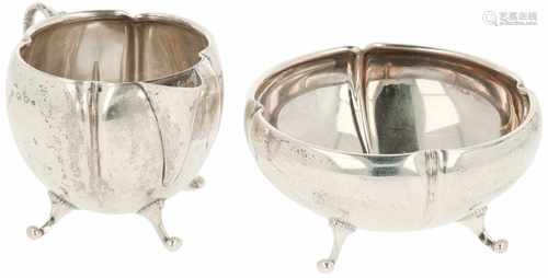 Set of silver creamers.