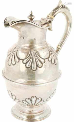 Silver hot water jug.