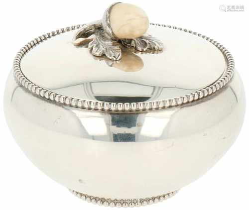 Silver sugar canister.