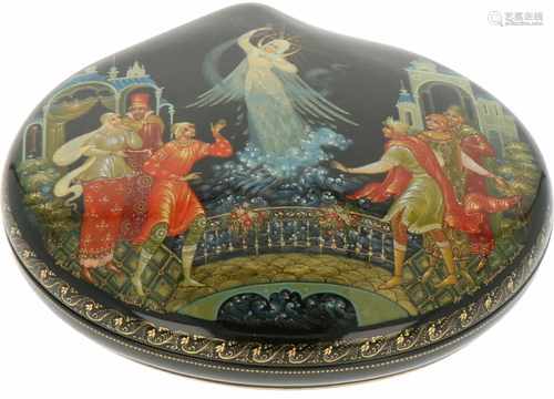 A Russian lacquer box in the shape of a St. Jacques shell with depicitons of a Russian farytale.