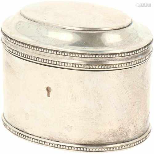 Silver tea caddy.