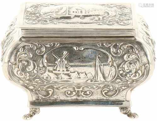 Silver tea caddy.