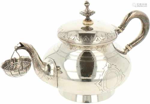 Teapot with silver spout tea strainer.