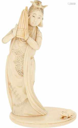 An ivory okimono of a Japanese lady. Japan, late Meiji period.