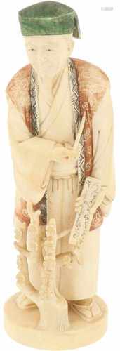 An ivory statuette of a scholar. Japan, late Meiji period.