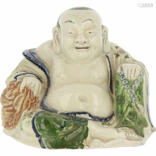 A porcelain seated Buddha. China, 2nd half 20th century.