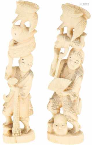 A set of (2) ivory okimono's in the shape of Japanese gentleman with animals. Japan, late Meiji