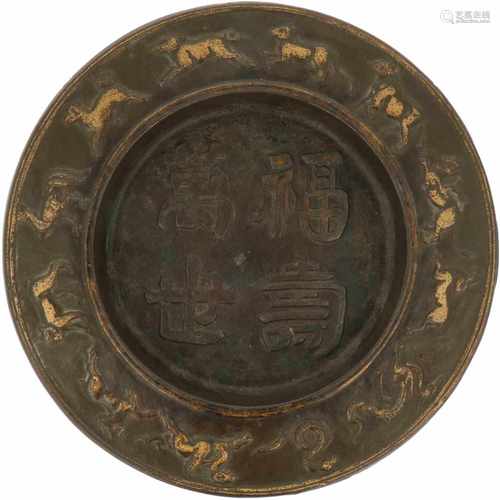 A bronze charger with Chinese characters. China, 20th century.