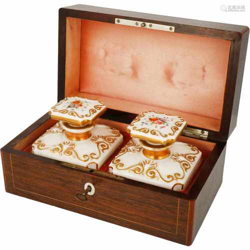 A fruitwood veneered tea caddy, the interior with porcelain flasks. France, 19th century.