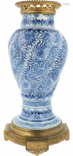 A porcelain vase with bronze mounts. China, Kangxi.