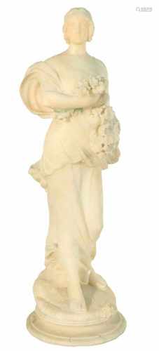 A marble statue depicting Flora. Or possibly one of the Four Seasons.