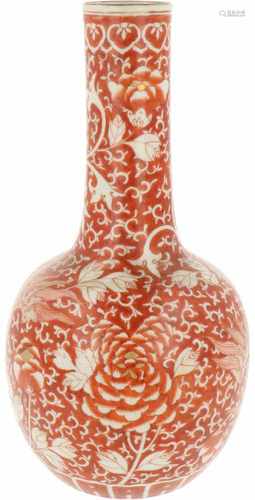 A porcelain baluster vase with iron red dragon décor. China, 19th century. 