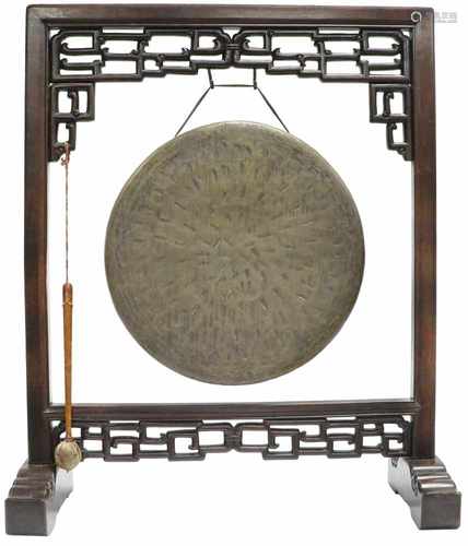 A bronze gong on a wooden stand. China, 2nd half 20th century.