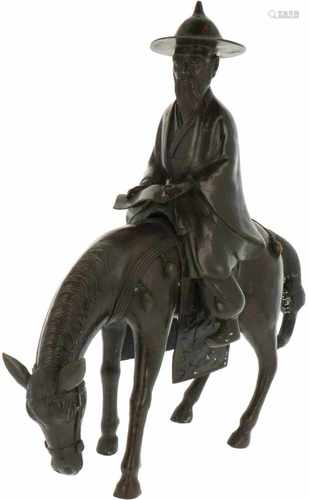 A bronze sculpture depicting a horse and elderly gentleman. China, 1st half 20th century.