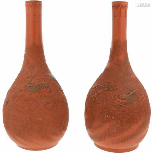 A set of (2) terracotta vases with dragon décor. China, late 20th century. 