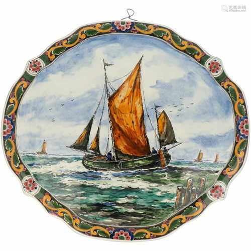 An earthenware wall applique with 'a vessel at sea'-motif. The Netherlands, Second half 20th