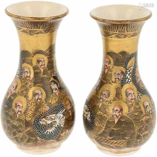 A set of two Satsuma earthenware vases, with depictions of Japanese figures and dragons. Japan, late