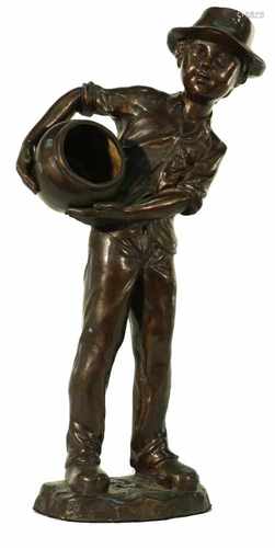 A bronze statue in the shape of a boy with a vase. Late 20th century.