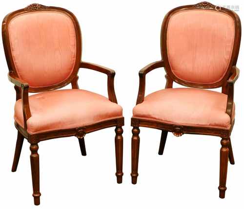 A pair of chairs with pink textile upholstery. Second half 20th century.