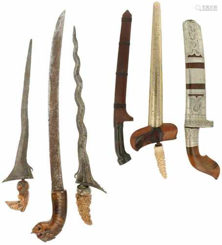 A collection of Indonesian weapons including (3) krises (Indonesian Archipelago), a Golok (ao