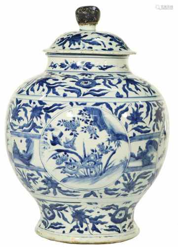 A porcelain lidded jar decorated with flowers. China, Ming.