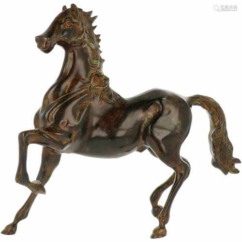 A bronze statue of a horse in an elegant posture. Second half 20th century.