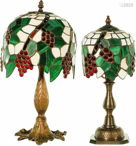 (2) Tiffany-style table lamps with stained glass in vine motifs. 20th century.