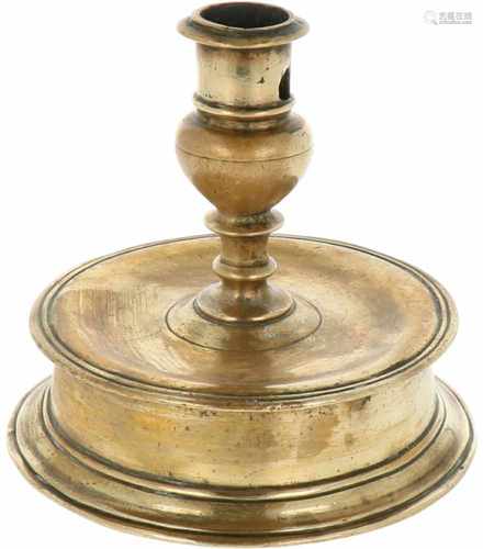 A bronze bell shaped candle stick. 18th century.