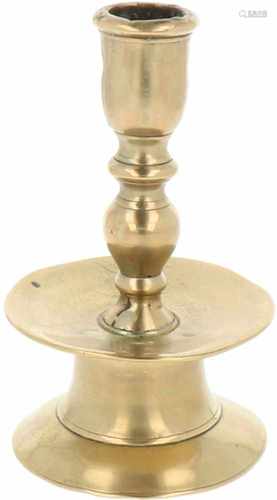 A bronze bell shaped candle stick. 18th century.