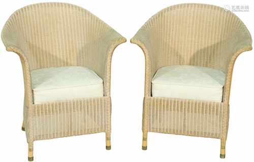 A pair of white laquered Lloyd Loom lounge chairs. 20th century.