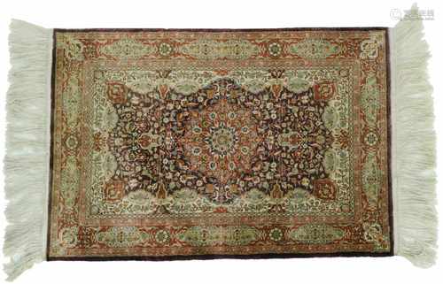 A silk 'Persian'rug.