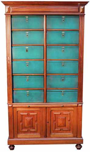 A mahony veneered filing cabinet with (12) green covered boxes. England, First half 20th century.