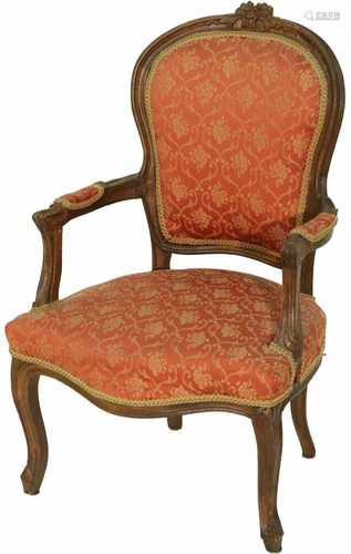 A Louis XV-style chair with red velvet upholstery.