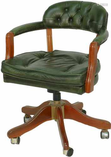 A 'Chesterfield' captains chair in green leather. 20th century.