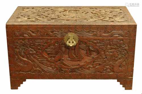 A colonial campher chest with wood carvings and brass mounts. Indonesia, First half 20th century.