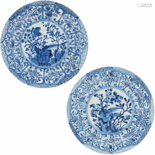 A set of two porcelain plates with segmented floral décor, marked with a lotus at the back. China,