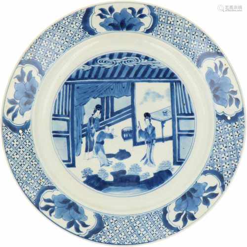 A porcelain plate with décor of figures, marked at the time. China, Kangxi. 