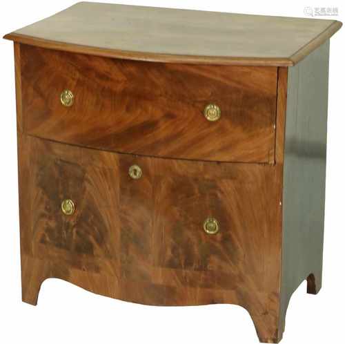 A small 19th century chest of drawers, installed as liquor cabinet.