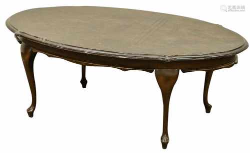 A coffeetable with faux-nutwood veneer. Second half 20th century.