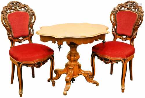 A fruitwood table on single base, together with (2) elaboratly carved chairs with red velvet.