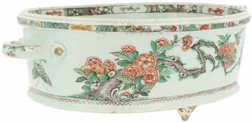 A Famille Verte porcelain jardinière mounted on three feet and with handles. China, Kangxi (ca.