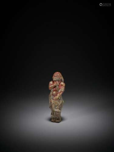 A RARE SAISHIKI NETSUKE OF A STANDING BEARDED FORE…