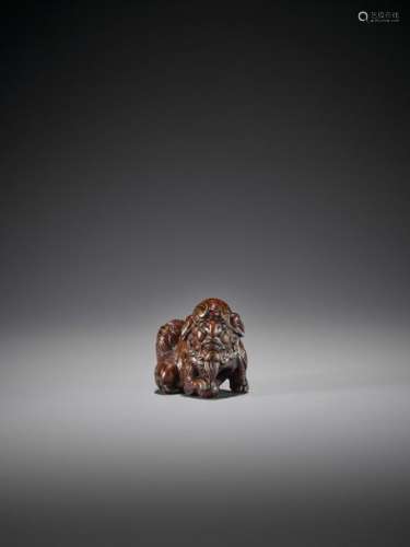 A VERY RARE LACQUERED WOOD NETSUKE OF A HUMAN FACE…